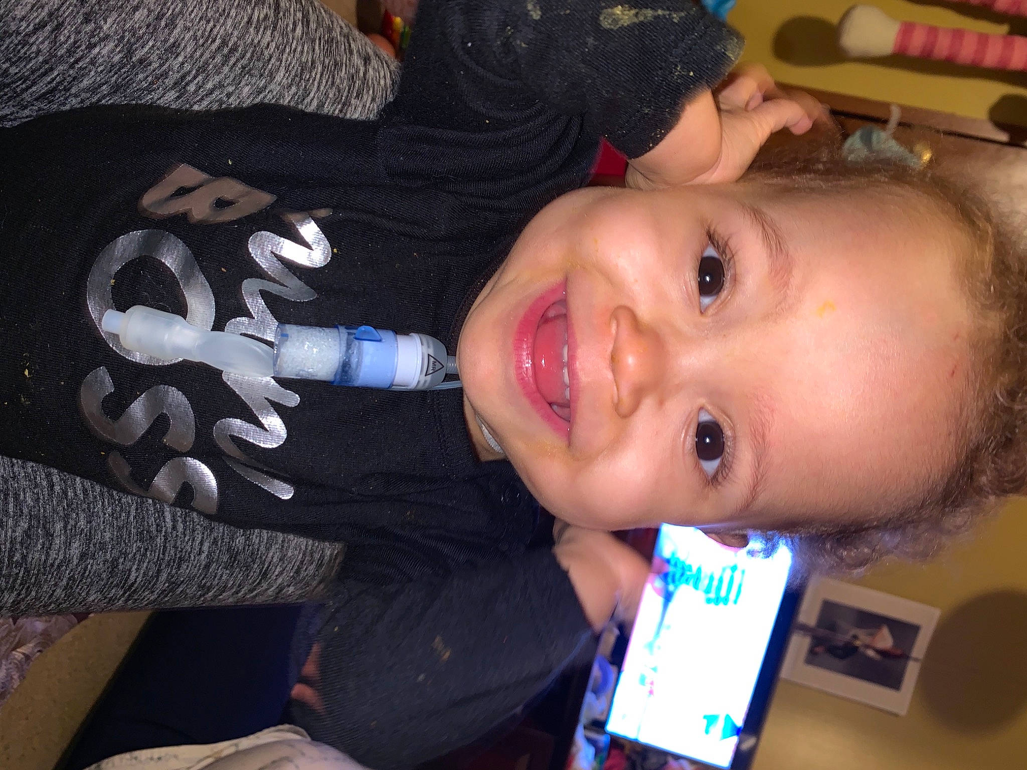 Amariah is registered to the contest to win money with this photo: cheek, child, electric_blue, eye, eyebrow, eyelash, face, facial_expression, finger, fun, happy, iris, joy, lip, mobile_phone, mouth, nose, person, skin, smile