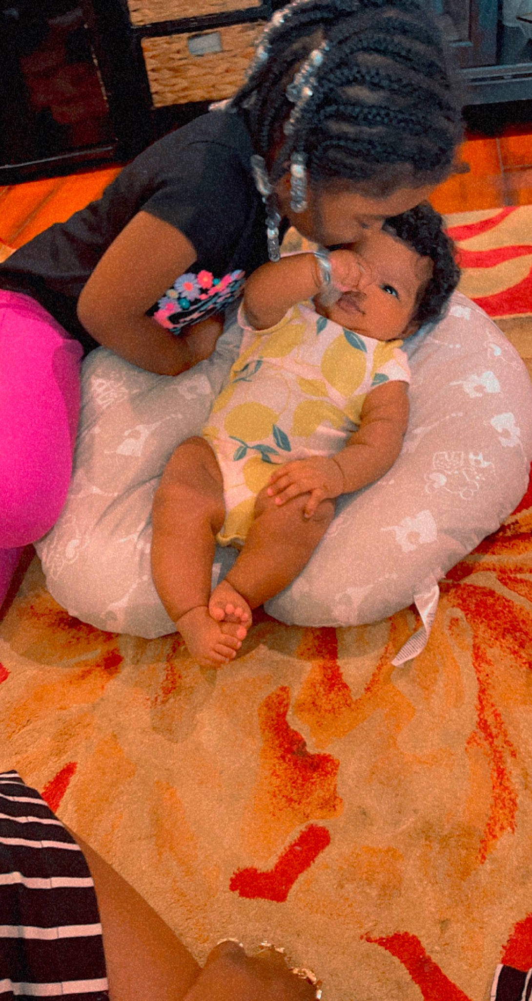 Jacqueline is registered to the contest to win money with this photo: abdomen, baby, barefoot, cheek, child, comfort, finger, happy, head, joint, lap, mouth, muscle, orange, person, pink, skin, textile, thigh, toddler