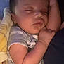 Jensen joined the competition — help win amazing prizes! baby, sleeping, infant, arm, blanket, onesie, striped_clothing, peaceful, closeup, face, skin, hand, resting, cozy, child, person, soft_lighting, indoors, head, cute