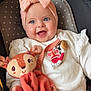 Tess a rejoint le concours — aidez-le/la à gagner de superbes lots ! baby, baby_clothes, blue_eyes, bow, child, cushion, cute, deer, hand, happy, headband, indoor, infant, patterned_pants, plush_toy, portrait, seat, smiling, toy, white_sweater