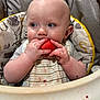Jasper is registered to the contest to win money with this photo: baby, high_chair, watermelon, bib, food, eating, juice, child, kitchen, cushion, clothing, face, hands, feeding, infant, toddler, messy, cute, portrait, indoor