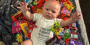 Jasper joined the competition — help win amazing prizes! baby, blanket, candy, celebration, child, colorful, cute, festive, funny_text, halloween, holiday, holiday_theme, infant, lying_down, onesie, snack, soft_texture, sweet, toddler, treats