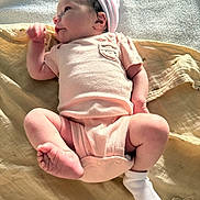 Aria is registered to the contest to win money with this photo: baby, newborn, infant, onesie, cap, blanket, soft_fabric, lying_down, cute, small_feet, baby_clothing, sleepwear, child, resting, indoor, skin, human, newborn_hat, baby_pose, peaceful