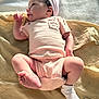 baby, newborn, infant, onesie, cap, blanket, soft_fabric, lying_down, cute, small_feet, baby_clothing, sleepwear, child, resting, indoor, skin, human, newborn_hat, baby_pose, peaceful
