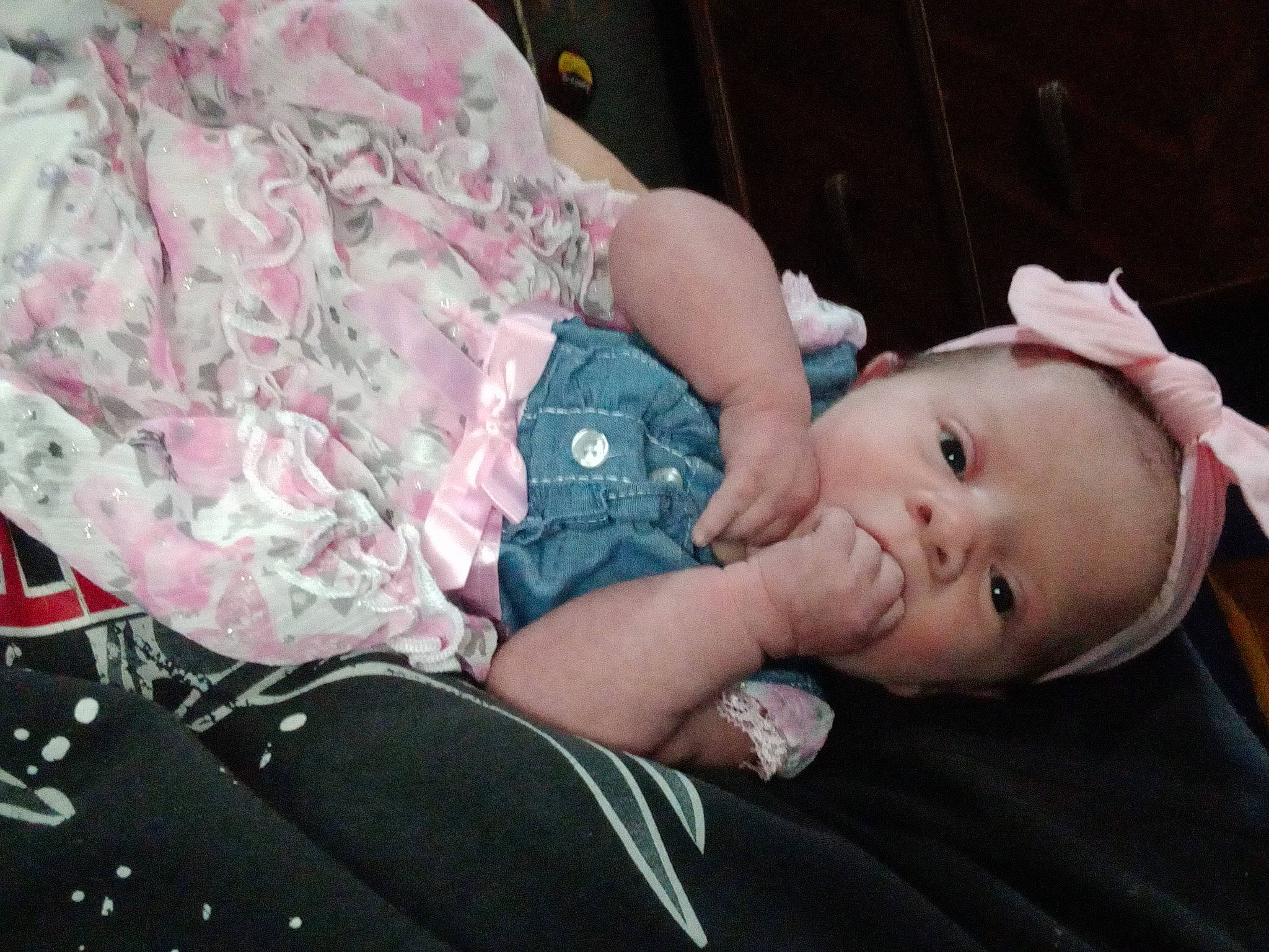 Courtney is registered to the contest to win money with this photo: baby, baby_products, baby_toddler_clothing, cheek, child, comfort, gesture, grass, happy, hat, military_camouflage, pattern, person, sitting, sleeve, toddler, tree