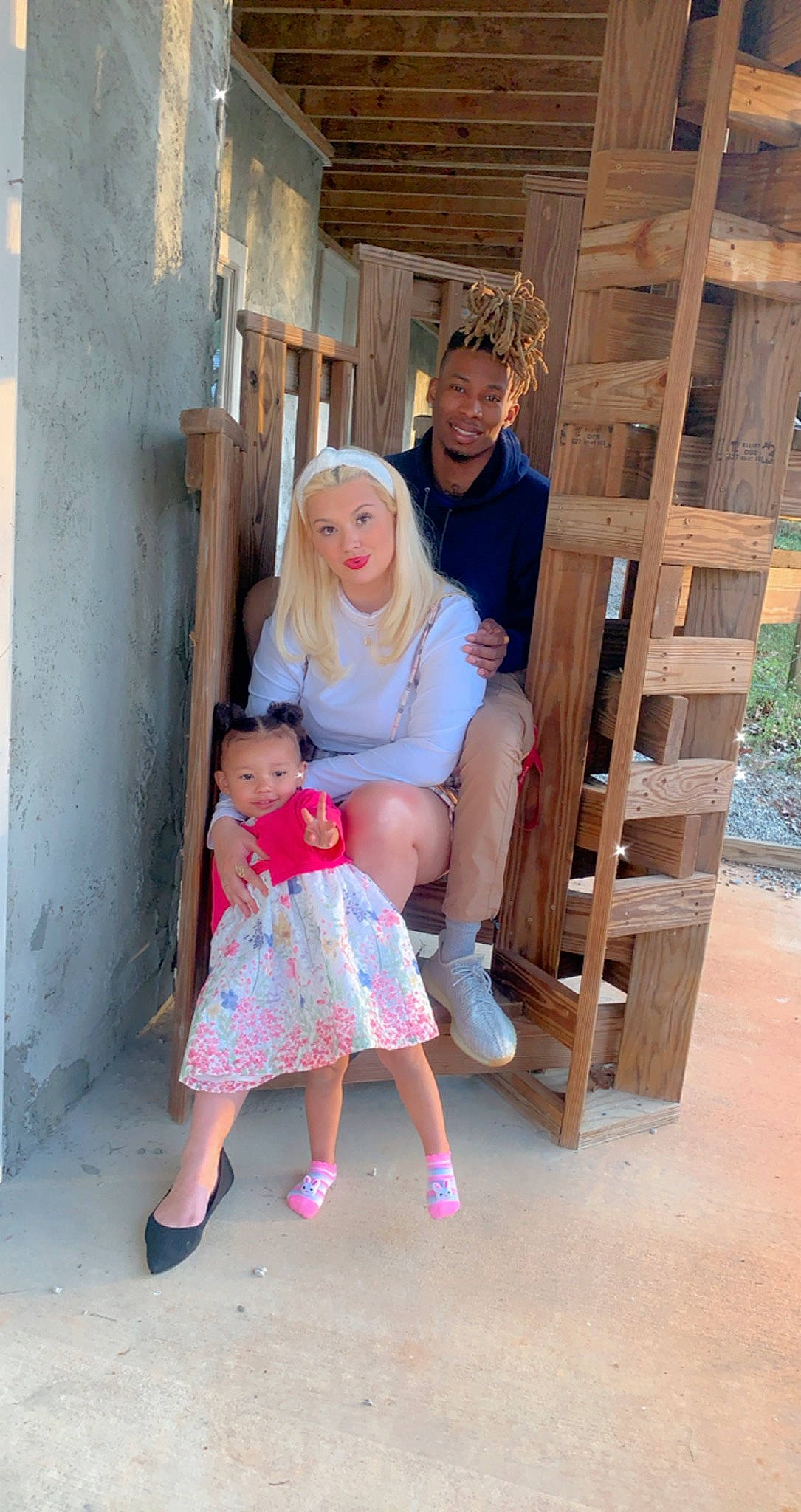 Sheshia is registered to the contest to win money with this photo: chair, child, event, foot, fun, happy, hat, headwear, joy, leisure, magenta, person, room, sandal, shorts, sitting, sock, standing, sun_hat, t_shirt