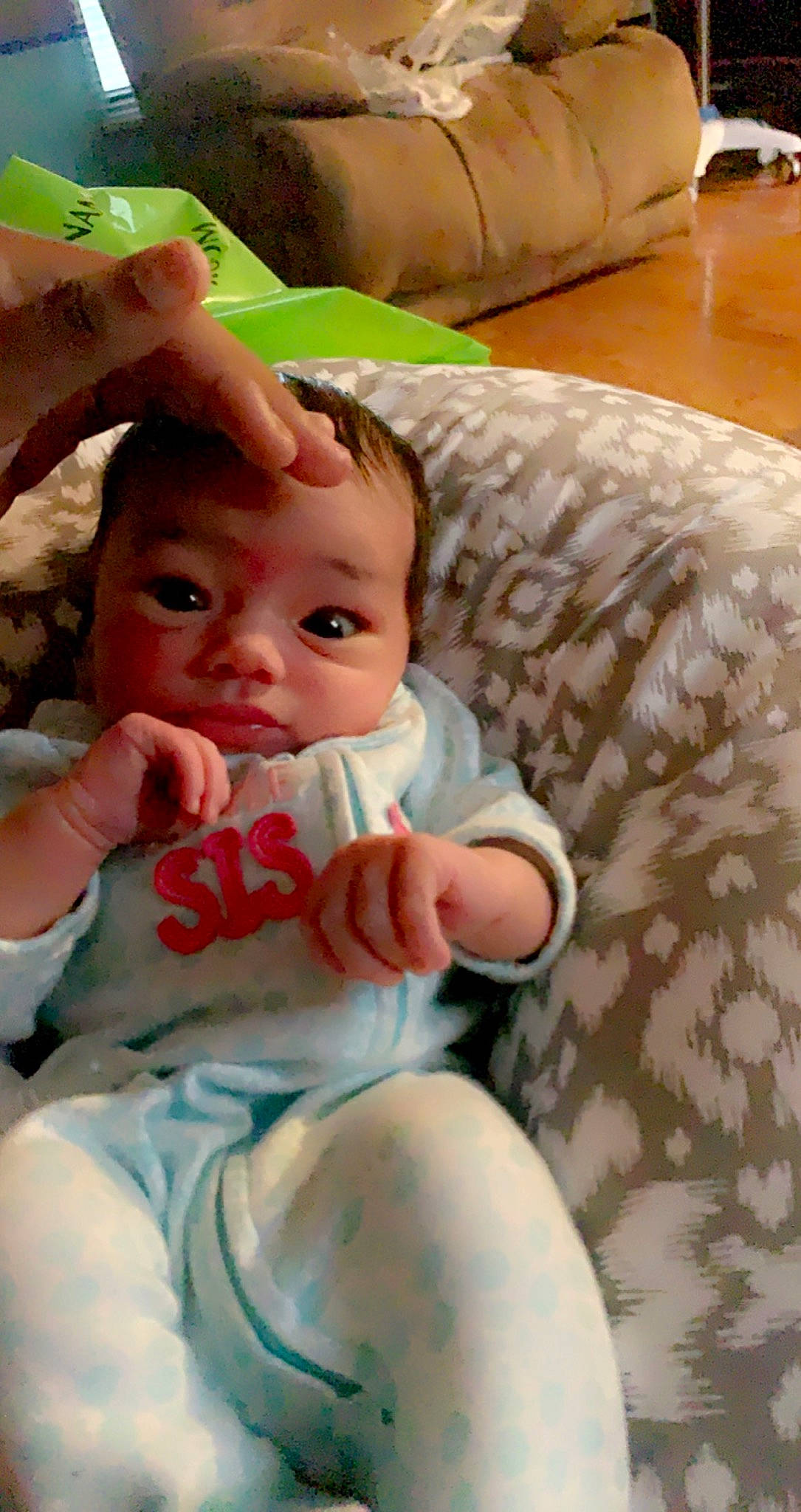 Hassen joined the competition — help win amazing prizes! baby, baby_toddler_clothing, cheek, comfort, couch, eyelash, finger, gesture, hand, happy, lip, mouth, nail, nose, person, room, sitting, skin, textile, thumb