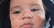 Levi is registered to the contest to win money with this photo: baby, blue_shirt, car, car_seat, cheeks, child, close_up, eyes, face, head, hood, indoors, infant, jacket, photography, portrait, selfie, serious_expression, sitting, vehicle_interior