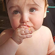 Lance joined the competition — help win amazing prizes! baby, child, face, hand, skin, eating, food, cute, curious, closeup, expression, natural_light, indoors, portrait, cheeks, fingers, mouth, naked, young, person