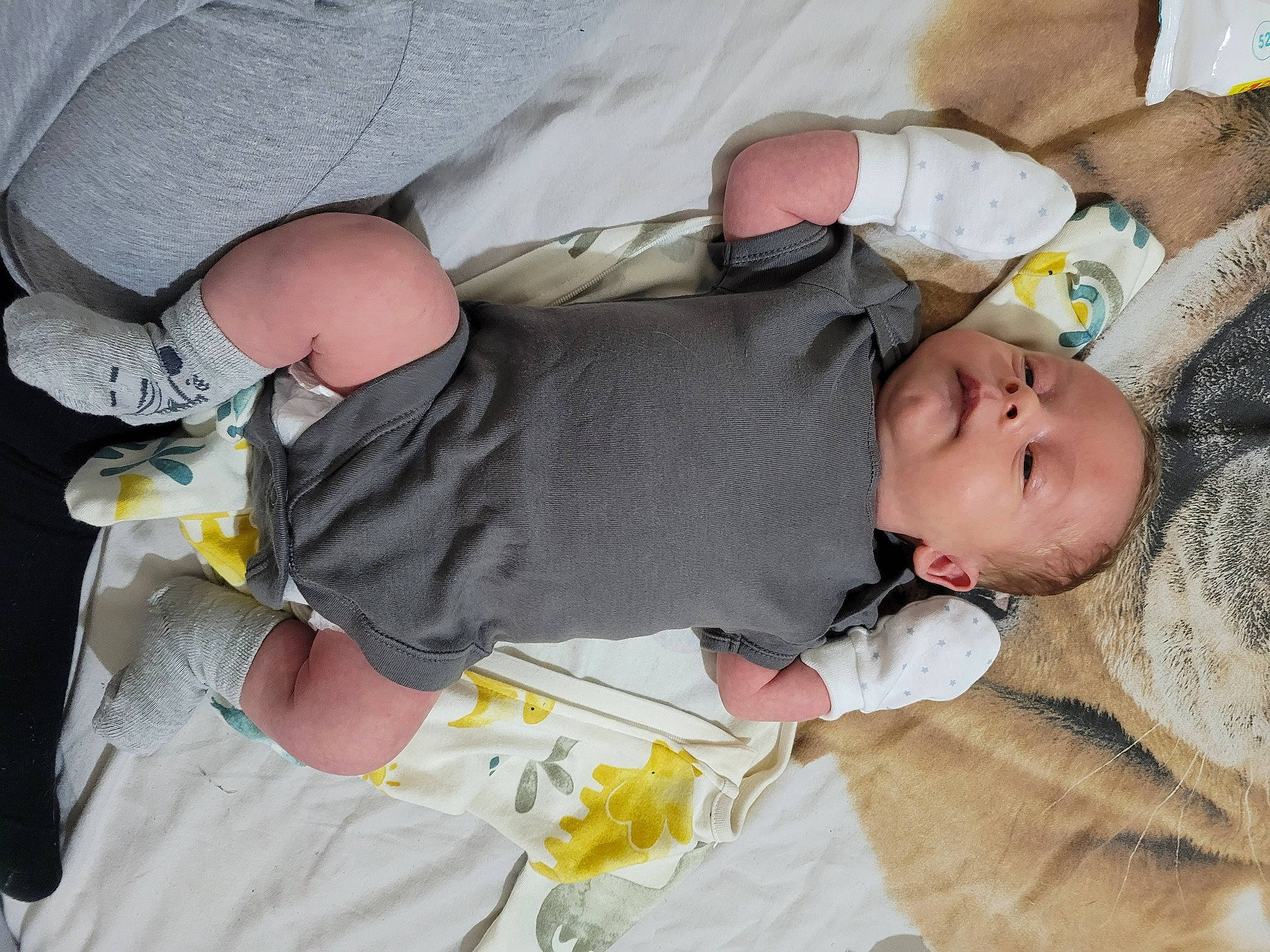 George joined the competition — help win amazing prizes! baby, baby_products, baby_toddler_clothing, child, comfort, elbow, finger, gesture, hand, human_leg, joint, linens, nail, person, room, sleep, textile, thumb, toddler, wrist