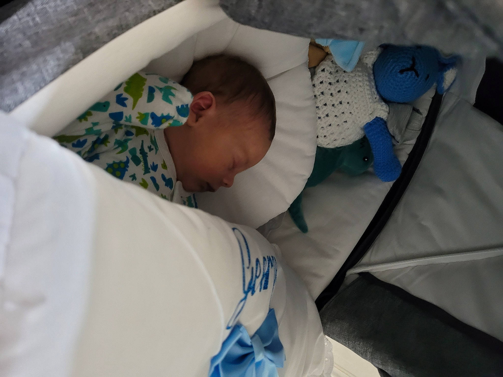 George is registered to the contest to win money with this photo: baby, baby_products, baby_safety, baby_sleeping, baby_toddler_clothing, bed, bedding, bedtime, blue, child, comfort, electric_blue, event, hospital, infant_bed, linens, nap, pattern, person, room