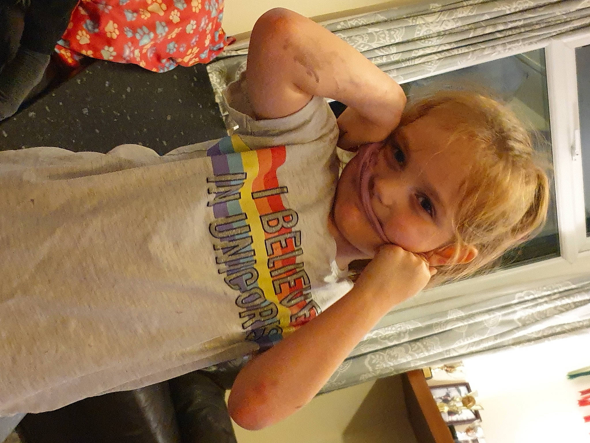 Isla-louise is registered to the contest to win money with this photo: baby, baby_toddler_clothing, child, comfort, elbow, eye, fun, happy, human_body, joy, pattern, person, room, sitting, sleeve, smile, t_shirt, thigh, thumb, toddler