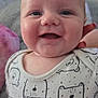 Leo-John is registered to the contest to win money with this photo: baby, smiling, infant, onesie, bear_print, cute, happy, face, child, person, closeup, skin, head, eyes, mouth, hand, apparel, indoor, comfort, portrait