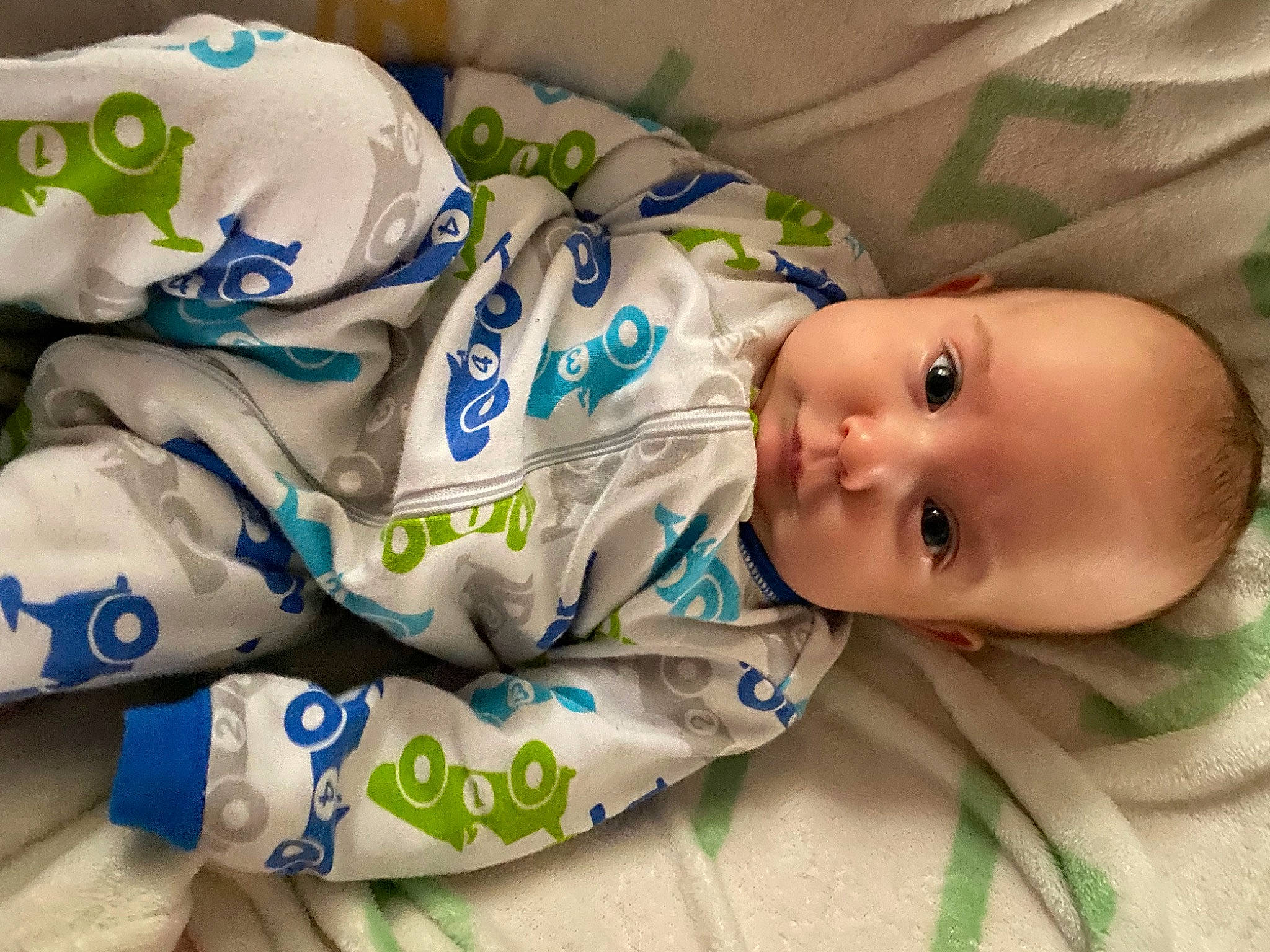 Eleanor is registered to the contest to win money with this photo: baby, baby_products, baby_toddler_clothing, carmine, cheek, child, comfort, face, facial_expression, finger, happy, head, linens, pattern, person, product, skin, sleeve, smile, textile