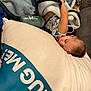 Jaxon is registered to the contest to win money with this photo: toddler, sleeping, blanket, pillow, bottle, indoors, child, rest, comfort, cozy, nap, clothing, couch, face, peaceful, baby, soft, relaxation, home, furniture