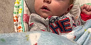Atlas is registered to the contest to win money with this photo: baby, sleeping, blanket, cushion, infant, cozy, clothing, face, child, peaceful, indoors, comfort, rest, portrait, soft, young, cute, head, closeup, relaxation