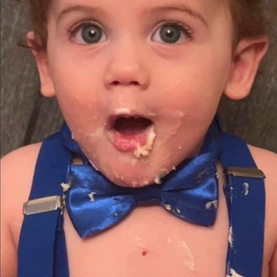 Jacob is registered to the contest to win money with this photo: accessories, baby, eating, face, food, formalwear, head, person, spitting, surprised, tie