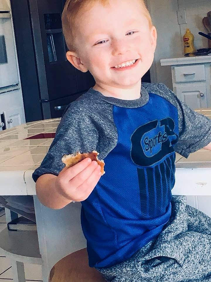 Landon is registered to the contest to win money with this photo: arm, blue, boy, child, day, finger, joy, outerwear, person, product, shoulder, sleeve, smile, standing, t_shirt, textile, toddler, top