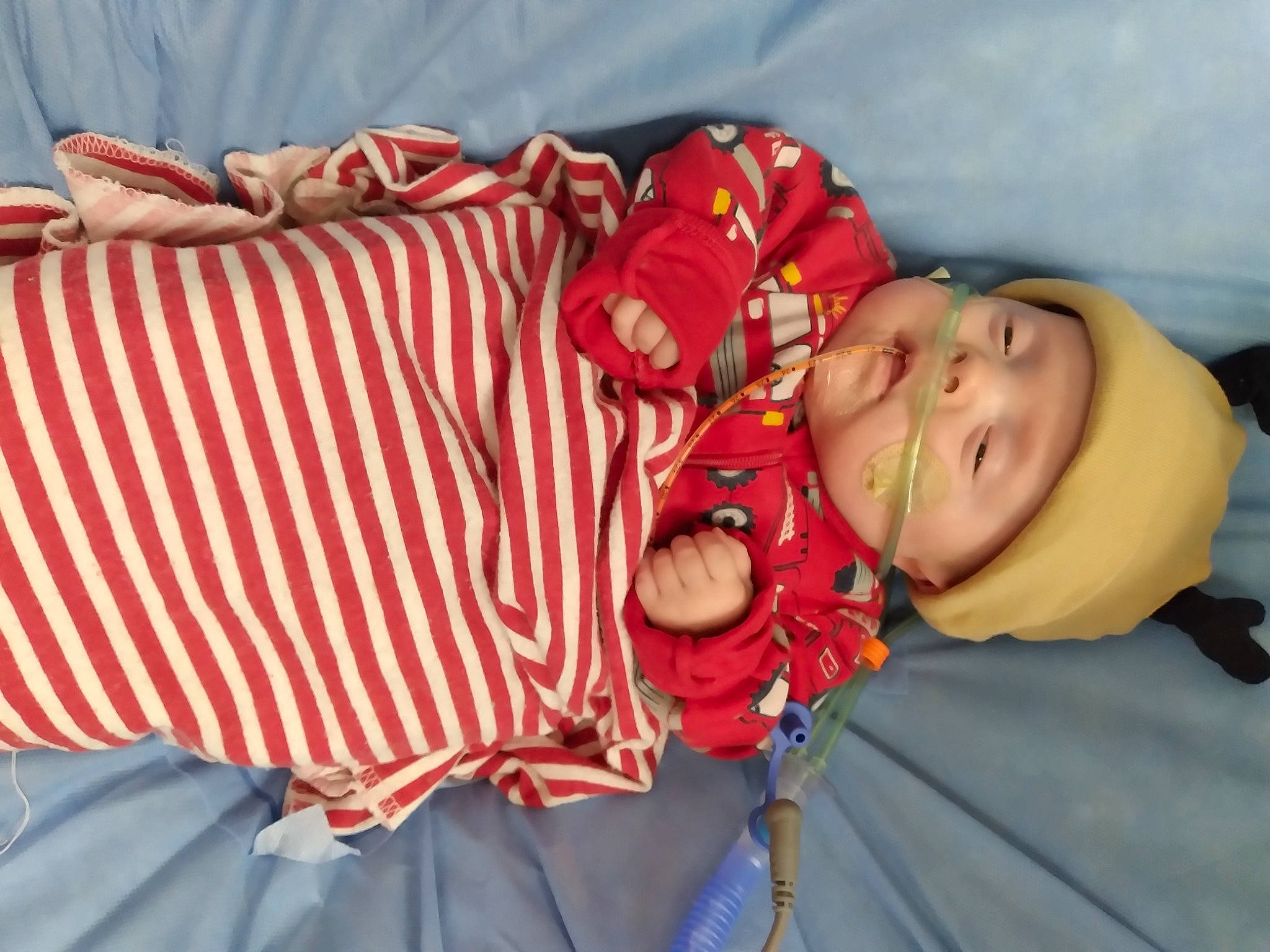 Kolten joined the competition — help win amazing prizes! baby, baby_products, baby_toddler_clothing, child, comfort, event, eye, face, fun, happy, hat, headwear, linens, pattern, person, room, sitting, sleeve, smile, textile