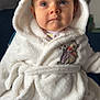 baby, child, face, hood, robe, white, soft, fluffy, blanket, indoor, cute, blue_eyes, clothing, portrait, warm, cozy, toddler, expression, sitting, plush