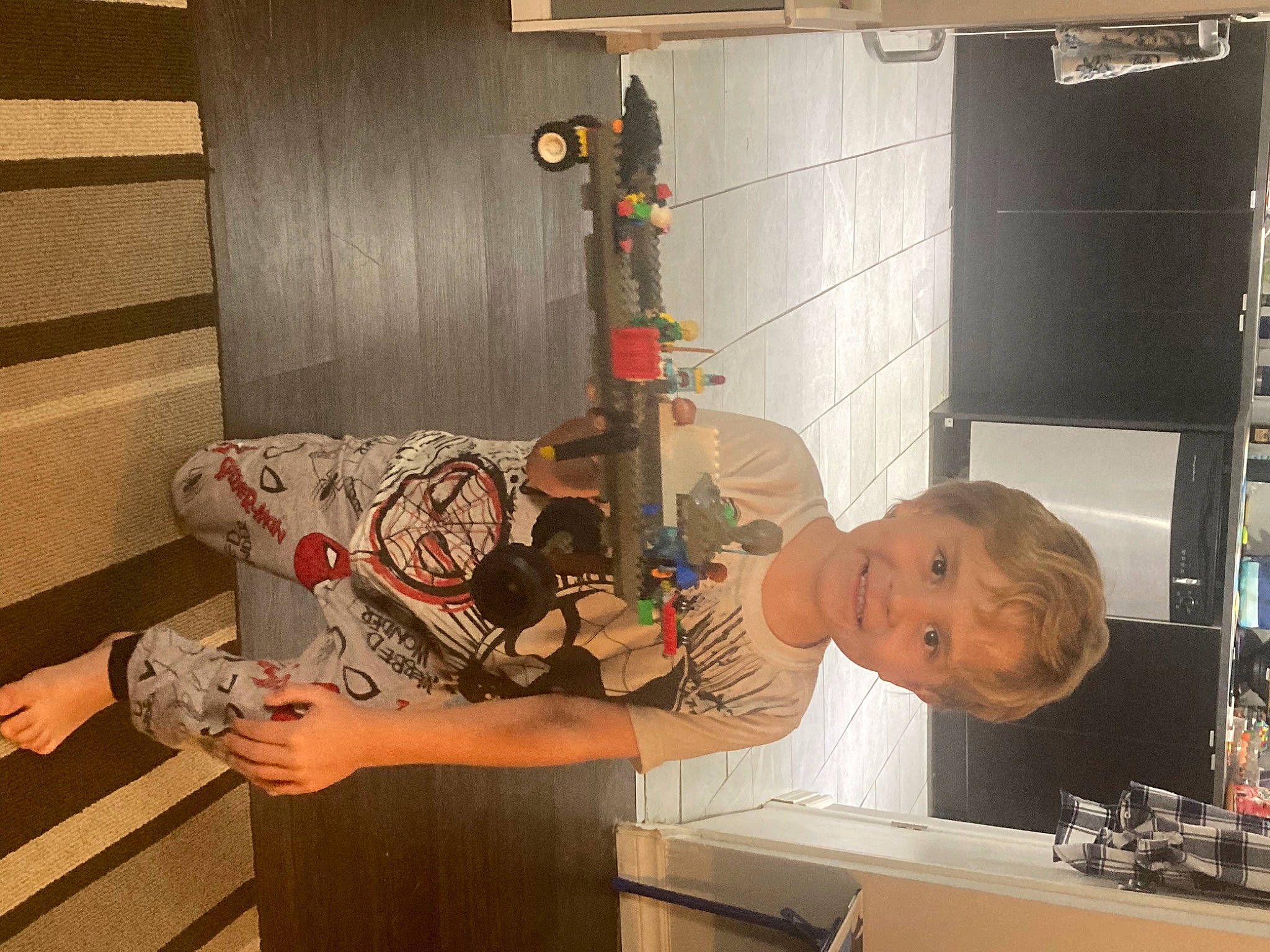 Zaxtyn joined the competition — help win amazing prizes! art, cabinetry, child, elbow, flooring, fun, hardwood, homemaker, joy, kitchen, machine, person, refrigerator, room, shelf, t_shirt, visual_arts, wood