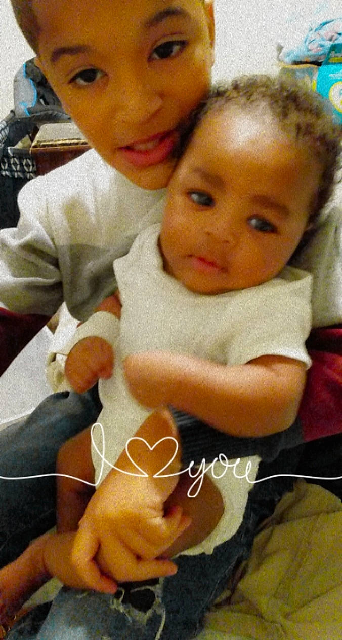 Zyaire is registered to the contest to win money with this photo: arm, baby, cheek, chin, eye, eyebrow, face, facial_expression, finger, fun, hairstyle, happy, iris, mouth, nose, organ, people, person, skin, thumb