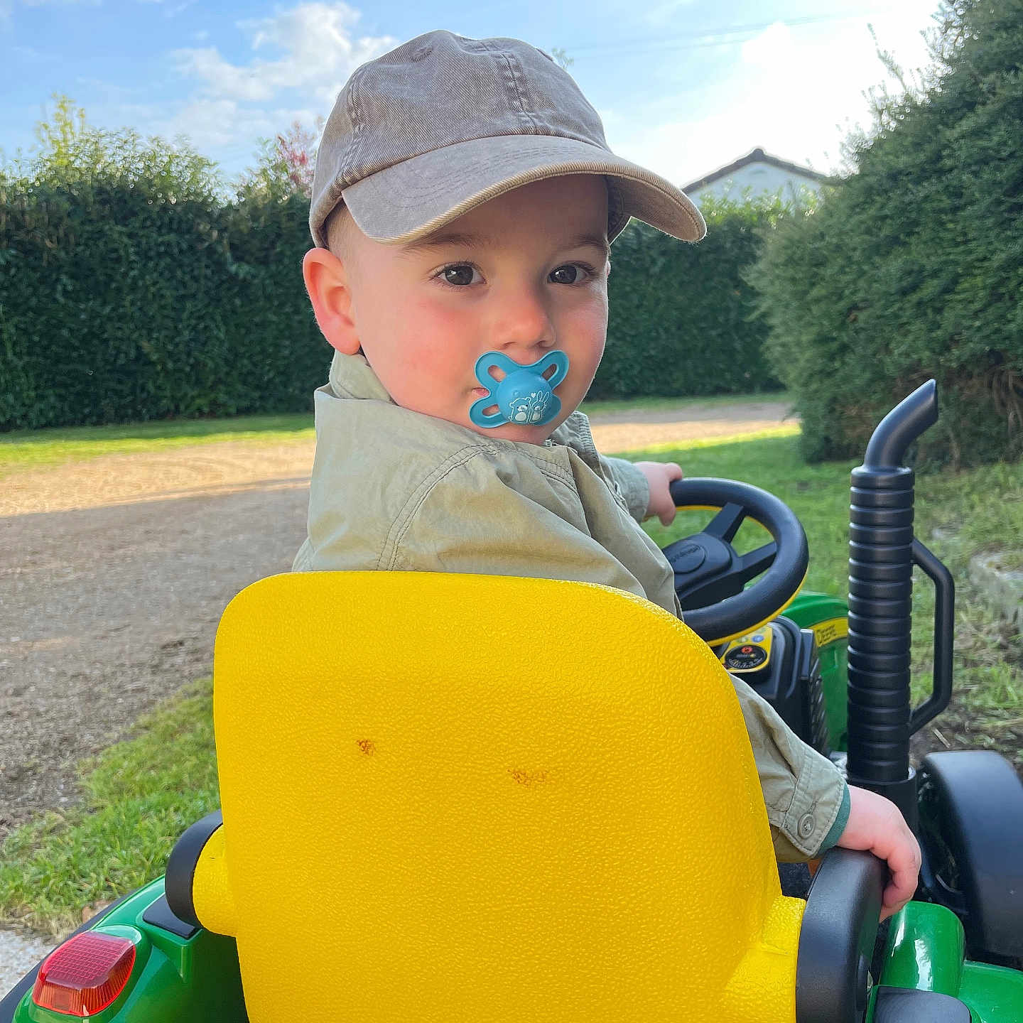 Nolan participe au concours pour gagner de l'argent avec cette photo : baby, baseballcap, cap, clothing, face, grass, hat, head, lawn, nature, outdoors, park, person, photography, plant, playarea, portrait, summer, tree, vegetation
