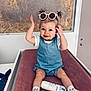 Cléa participe au concours pour gagner de l'argent avec cette photo : toddler, child, baby, sunglasses, denim_romper, white_tshirt, socks, lotion, changing_pad, indoor, smiling, blue_eyes, short_hair, playful, furniture, soft_texture, pink, white, casual_clothing, portrait