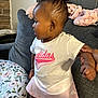 Jariya joined the competition — help win amazing prizes! adidas, blanket, child, clothing, couch, cute, floral_pattern, flower, furniture, girl, hair_accessory, hand_holding, indoors, person, pillow, pink, profile, skirt, toddler, white_tshirt