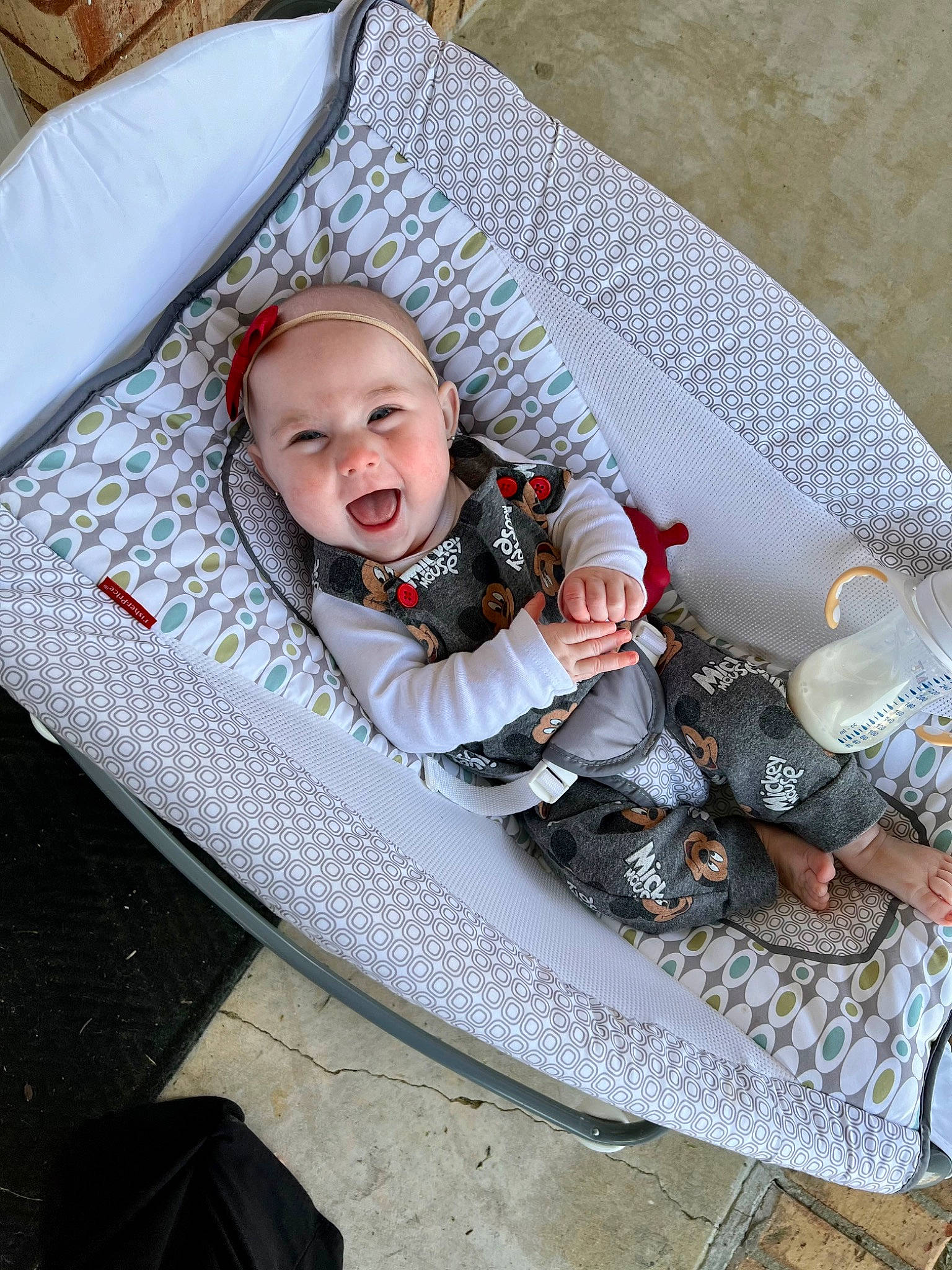 Stevie is registered to the contest to win money with this photo: auto_part, baby, baby_carriage, baby_products, baby_toddler_clothing, child, circle, comfort, fashion_accessory, grey, linens, pattern, person, recreation, sitting, smile, textile, toddler