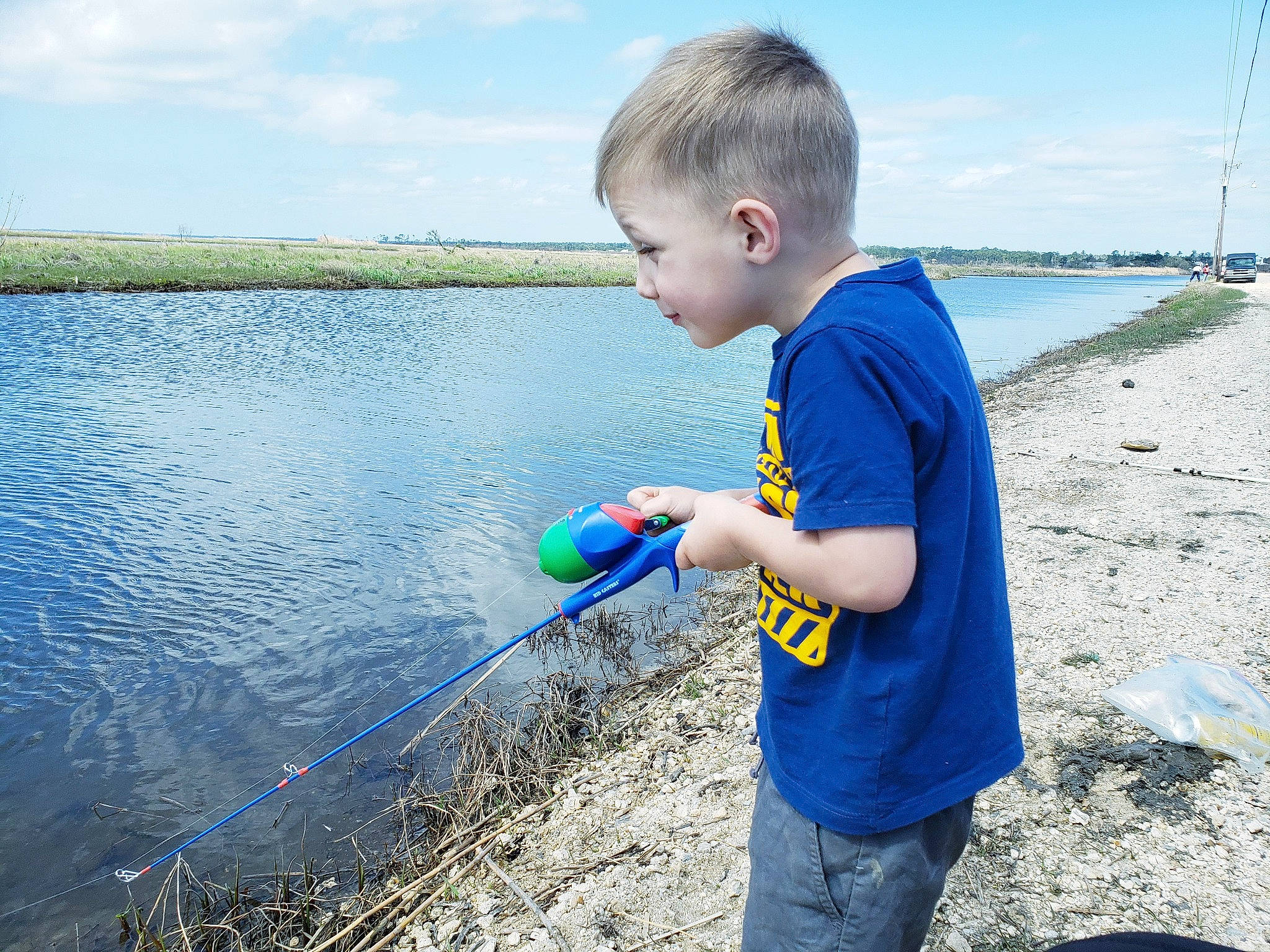 Blake joined the competition — help win amazing prizes! angling, body_of_water, child, cloud, coast, electric_blue, fun, grass, jeans, lake, leisure, people_in_nature, person, recreation, shore, sky, soil, summer, t_shirt, toddler