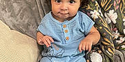 Athena is registered to the contest to win money with this photo: baby, child, toddler, curly_hair, blue_outfit, hair_bows, blanket, brush, sitting, indoors, cute, portrait, smile, face, eyes, wooden_buttons, couch, cozy, home, soft_texture