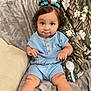 baby, blanket, blue_outfit, brush, child, couch, cozy, curly_hair, cute, eyes, face, hair_bows, home, indoors, portrait, sitting, smile, soft_texture, toddler, wooden_buttons