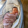 baby, bed, blanket, couch, cradle, crib, face, furniture, hardwood, head, infantbed, newborn, person, wood