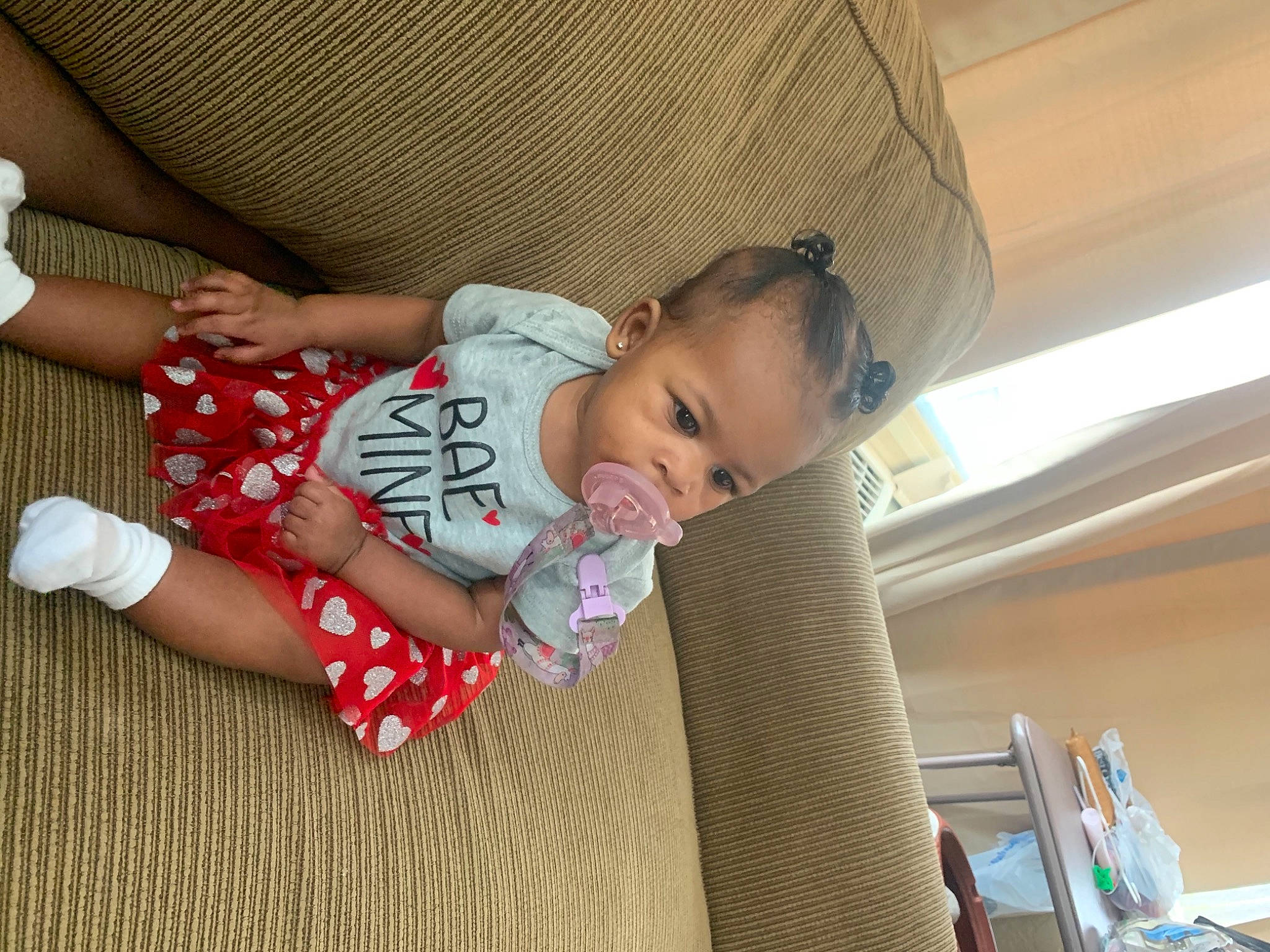 Kahlia joined the competition — help win amazing prizes! baby, baby_products, baby_toddler_clothing, cheek, child, comfort, couch, flooring, fun, human_leg, lap, pattern, person, room, sitting, skin, sleeve, sock, thigh, toddler