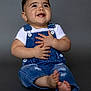 Bryan joined the competition — help win amazing prizes! baby, background, barefoot, child, clothing, cute, denim_overalls, expression, face, fashion, feet, hair, hands, happy, portrait, sitting, smiling, studio, white_shirt, young_child
