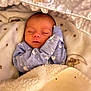 Zak joined the competition — help win amazing prizes! newborn, baby, sleeping, blanket, onesie, swans, soft_texture, cozy, infant, cute, peaceful, face, hand, bed, resting, warm, wrapped, comfort, portrait, indoors