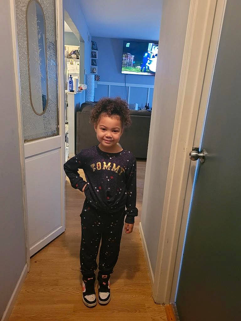 Alyona is registered to the contest to win money with this photo: cabinetry, door, door_handle, electric_blue, floor, flooring, fun, hardwood, home_appliance, home_door, joy, leg, person, refrigerator, shoe, shoulder, sleeve, smile, standing, sweatpant