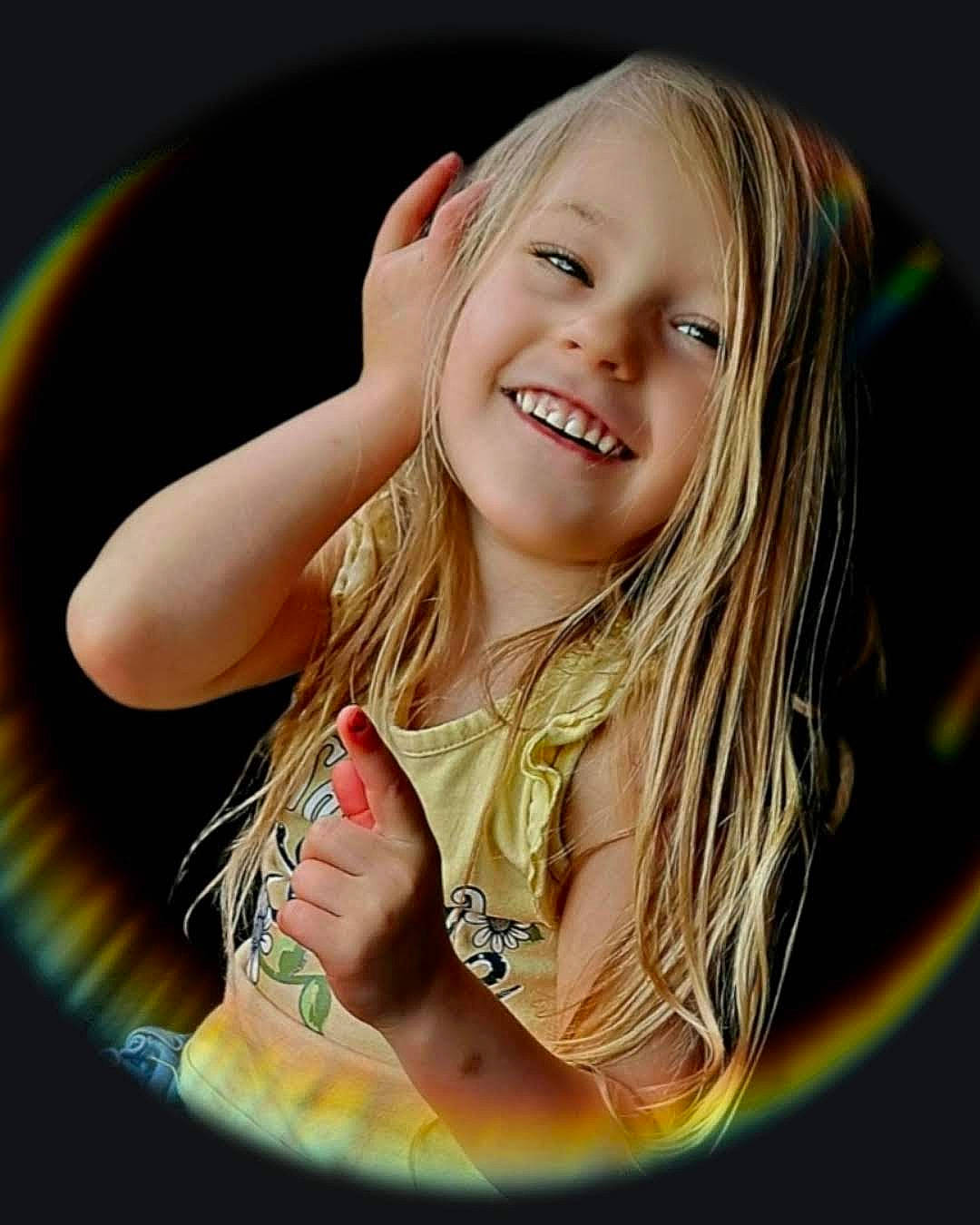 Ivy is registered to the contest to win money with this photo: blond, brown_hair, child, circle, cool, facial_expression, finger, flash_photography, fun, gesture, grass, happy, human_body, iris, joy, leisure, lip, people_in_nature, person, smile