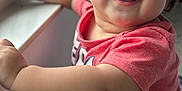 Yazan joined the competition — help win amazing prizes! toddler, child, smiling, red_shirt, window, curious, happy, indoor, portrait, face, arm, skin, hair, baby, expression, light, daylight, casual_clothing, person, closeup