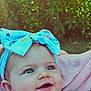 Dahlia joined the competition — help win amazing prizes! baby, blue_bow, headband, smiling, face, child, pink_blanket, outdoor, greenery, portrait, cute, happy, infant, clothing, closeup, skin, young_child, nature, headwear, expression