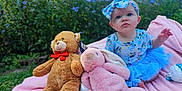 Dahlia joined the competition — help win amazing prizes! baby, child, tutu, headband, blue_clothing, pink_blanket, teddy_bear, stuffed_animal, plush_bunny, outdoor, garden, flowers, greenery, grass, cute, sitting, portrait, infant, toy, playtime