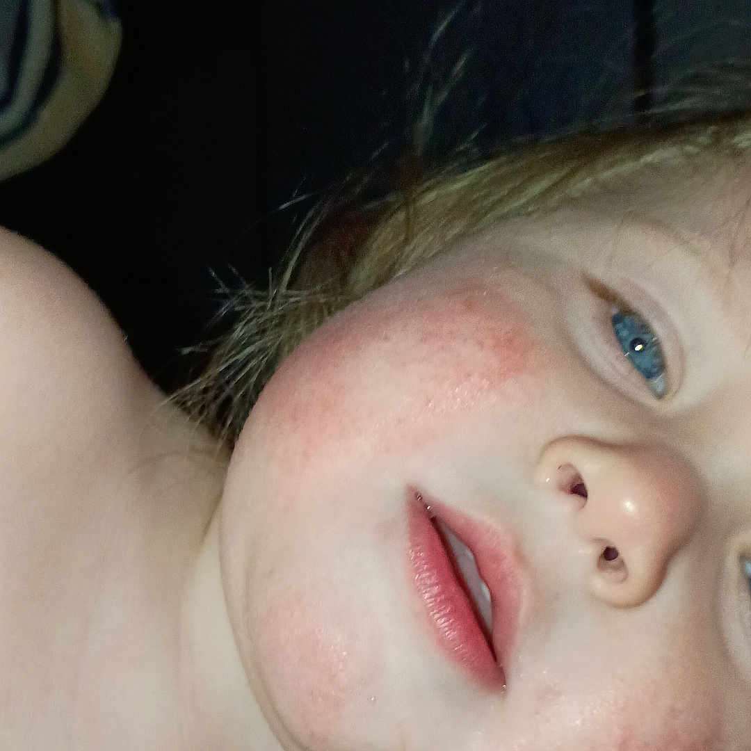 Giovanni is registered to the contest to win money with this photo: child, face, close_up, blue_eyes, rosy_cheeks, light_hair, indoor, skin, portrait, expression, person, young, casual, head, bare_shoulders, natural_light, human, cute, childhood, innocence