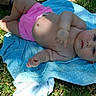 baby, infant, child, blue_eyes, pink_shorts, blanket, grass, outdoor, sunlight, shadow, cute, lying_down, polka_dot, skin, summer, nature, portrait, young, relaxing, curious