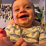 Ryder joined the competition — help win amazing prizes! baby, infant, child, smiling, laughing, face, portrait, close_up, indoors, home, striped_shirt, clothing, reaching, hand, eyes, mouth, happy, sitting, photography, background
