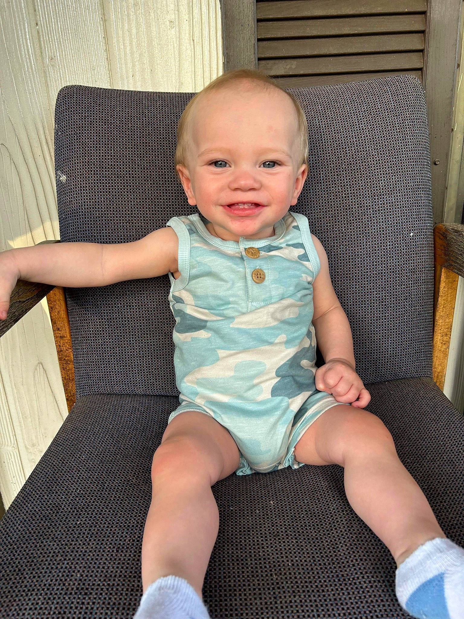 Macen is registered to the contest to win money with this photo: baby, baby_toddler_clothing, chair, child, comfort, eye, finger, hairstyle, happy, human_leg, iris, joy, lap, pattern, person, sitting, skin, sleeve, smile, sock