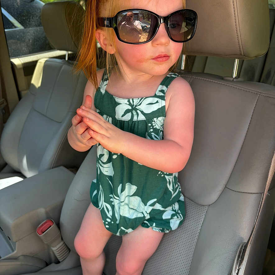 Kinslee is registered to the contest to win money with this photo: accessories, belt, bodypart, child, clothing, cushion, face, female, finger, footwear, girl, glasses, hand, head, homedecor, person, photography, portrait, shoe, sunglasses