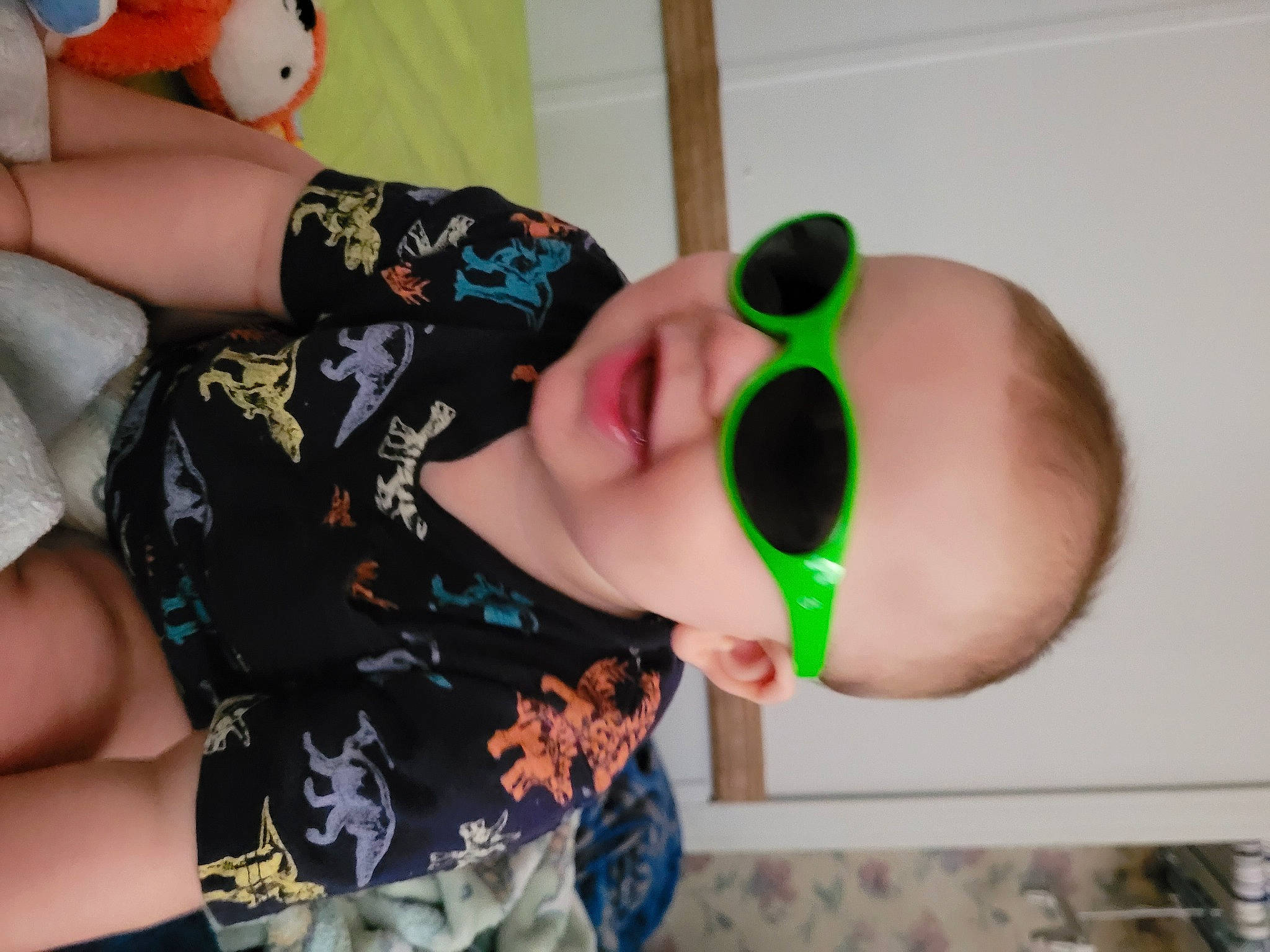 River is registered to the contest to win money with this photo: baby, black_hair, child, ear, elbow, eyebrow, eyelash, eyewear, finger, fun, hand, happy, joint, mouth, nail, nose, person, thumb, toddler, vision_care