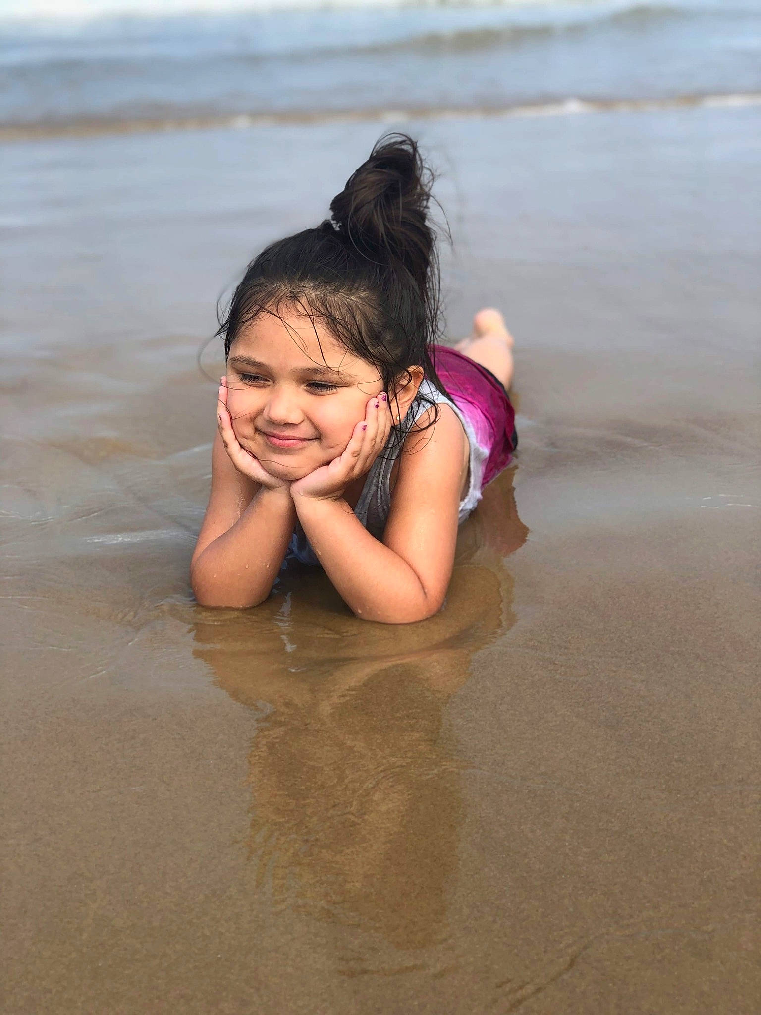 Abriana is registered to the contest to win money with this photo: bathing, beach, beauty, black_hair, child, facial_expression, fun, happy, joy, leg, leisure, long_hair, person, photography, play, recreation, sea, skin, smile, summer