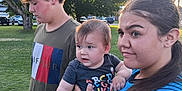 Adam joined the competition — help win amazing prizes! child, baby, girl, boy, outdoor, park, grass, tree, sunlight, curly_hair, holding, casual_clothing, blue_jacket, tshirt, people, daytime, nature, portrait, family, cute
